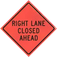 right lane closed ahead diamond warning sign for construction zone